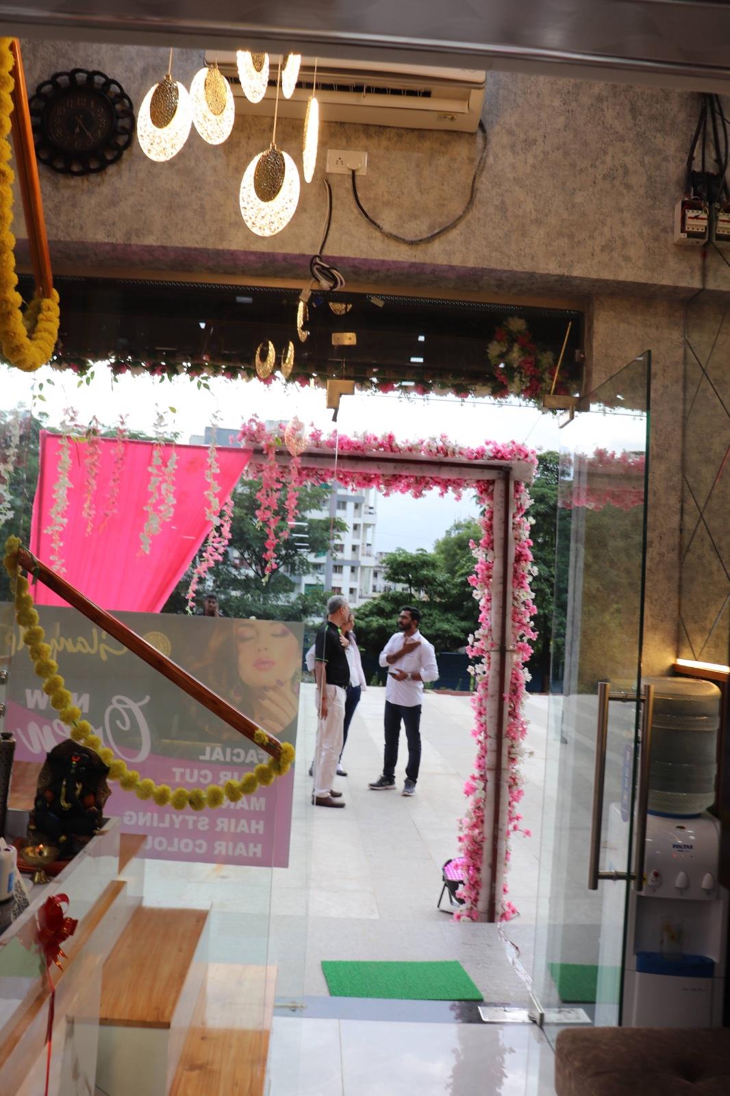 GlamUp Salon entrance with decorative lighting and floral frontage